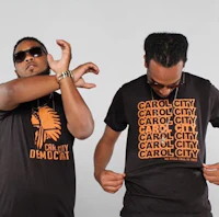 two men wearing t - shirts that say carolina city